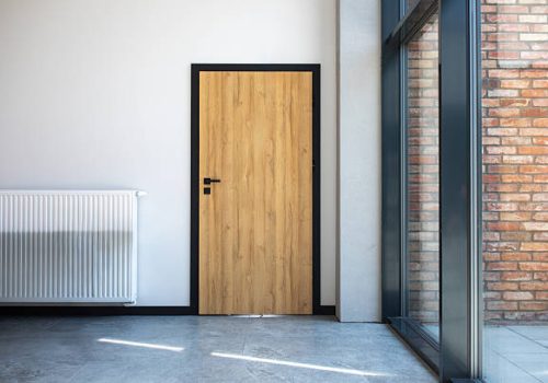 Designer entrance door to building. Modern design. luxurious exterior. Facade of a modern building with modern doors.
